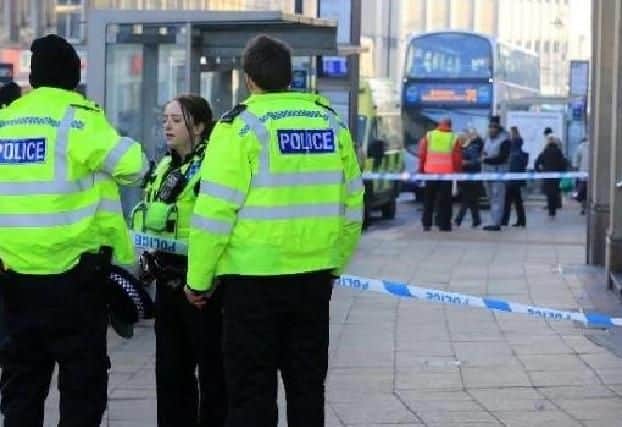 Police officers outside McDonald's in Sheffield city centre after a man was attacked in January