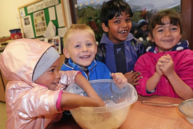 Children pictured baking Gingerbread Cavemen.