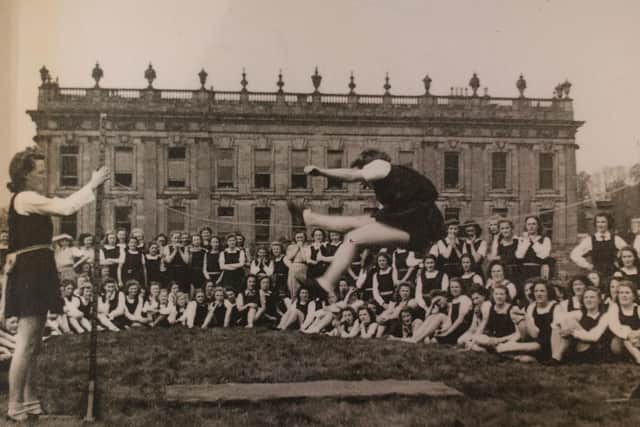 Pupils from Penrhos College competing in the high jump in the Chatsworth gardens