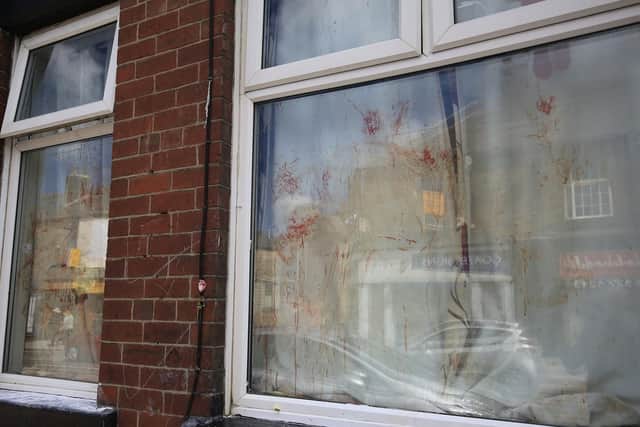 Blood all over the front window of a house on Holme Lane, Hillsborough.