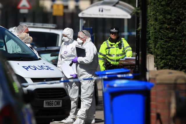 Forensics officers. Picture: Danny Lawson/PA Wire