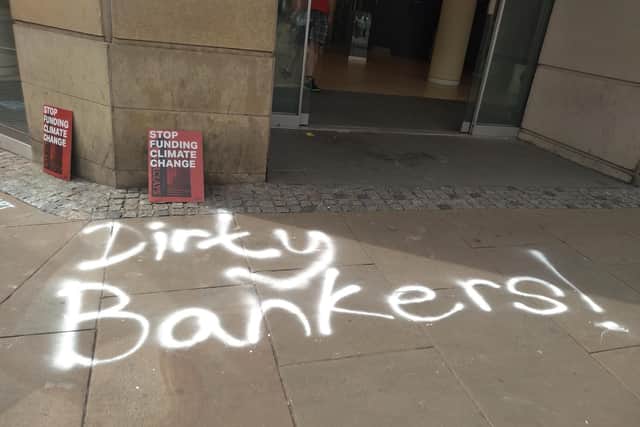 Protesters chalked slogans outside Barclays Bank in Pinstone Street