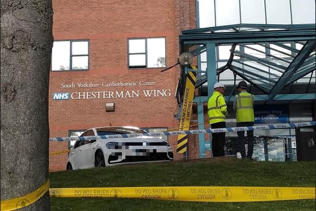 Workmen in the grounds of the Northern General Hospital after a bus crash (Pic: Robert Scott)