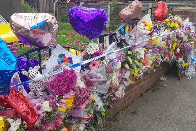 Floral tributes which have been left outside a property in the Shiregreen area of Sheffield where Blake Barrass, 14, and 13-year-old Tristan Barrass died following an incident on Friday. Picture: Dave Higgens/PA Wire