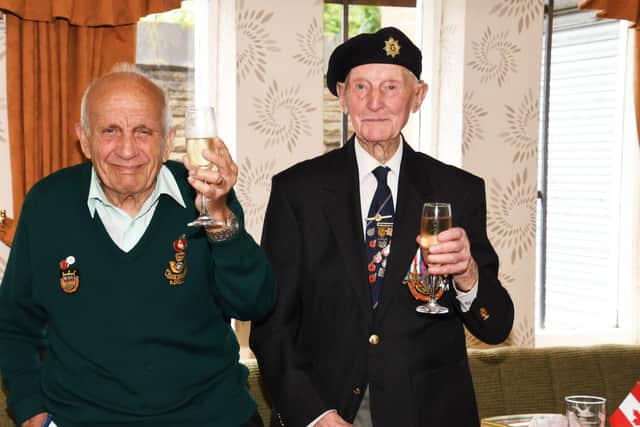 Cyril Elliott (right) and fellow veteran George Hodgson raise their glasses to the Queen as Cyril celebrates his 99th birthday (pic: Peter Wolstenholme)
