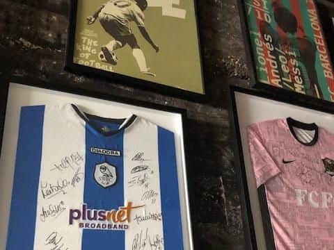 Signed Wednesday shirt on display in the Toffee Club, where the Portland group of Owls Americas watch games.