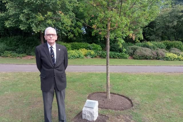 Graham Askham at the tree and plaque.
