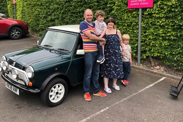 The family before taking a spin in the Mini.