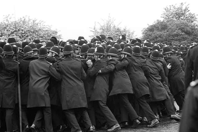 File photo dated 01/06/1984 of police officers pushing against striking miners outside the Orgreave Coking Plant