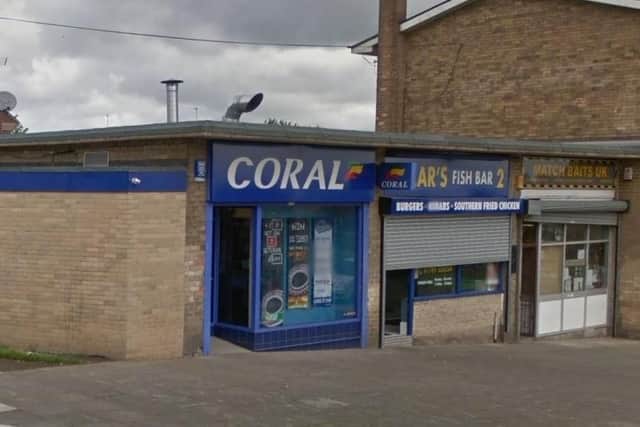 Two armed robbers raided a bookmakers in Rotherham