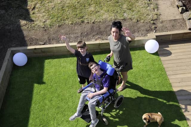 A charity has finished a back garden makeover for Lauren Chappell and her children.