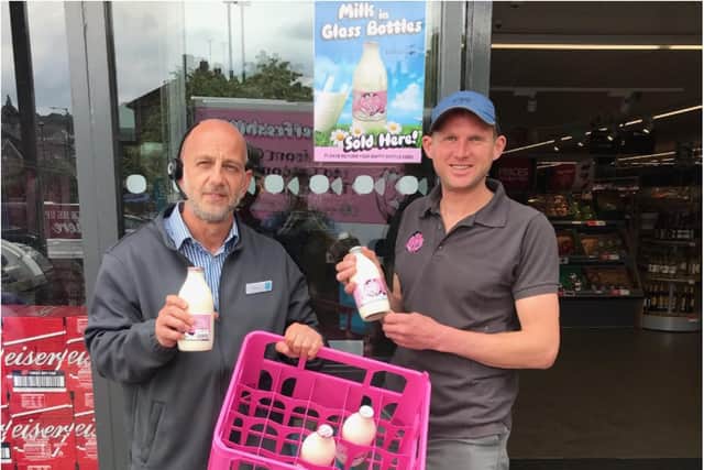 Store manager Pete Cooper and Our Cow Molly's Eddie Andrew outside the Ecclesall Road Co-op, which has begun stocking milk in glass bottles