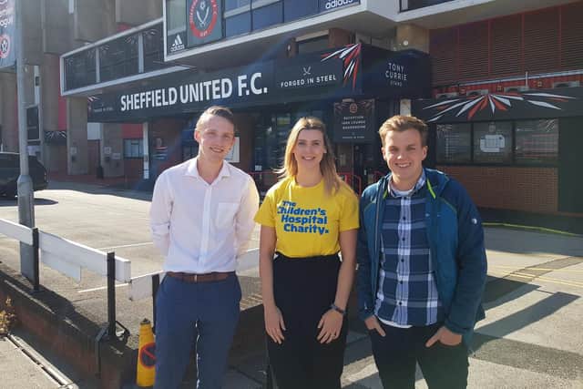 George Battersby (left) and Mark Swift, creators of the new Sheffield United fanzine Cuttin Edge Blades, with Lucy Rathbone, from The Children's Hospital Charity