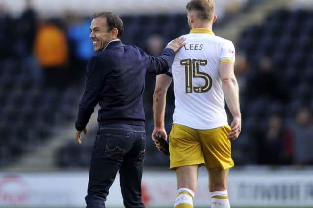 Happy with the win Owls Manager Jos Luhukay congratulates skipper Tom Lees.....Pic Steve Ellis