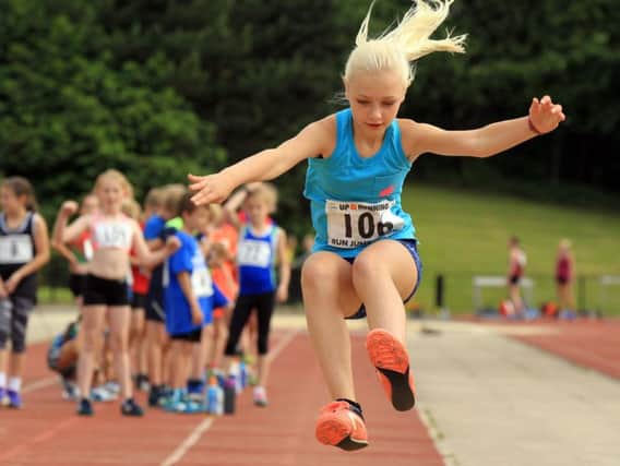 A young long-jumper captured mid-flight during a meeting at Sheffield Hallam University City Athletics Stadium last year