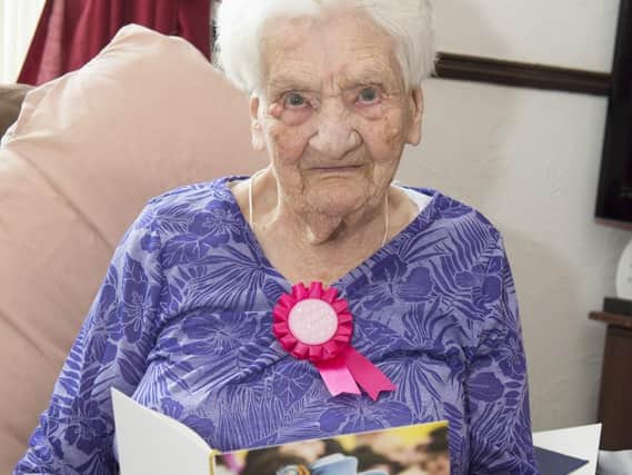 Doris Twigg celebrating her 100th birthday with a card from The Queen