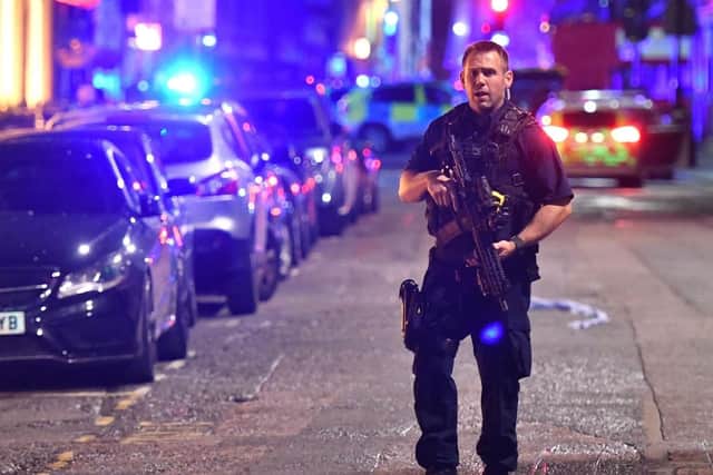 An armed police officer on the night of the London Bridge terrorist attack (Picture: Dominic Lipinski/PA Wire).