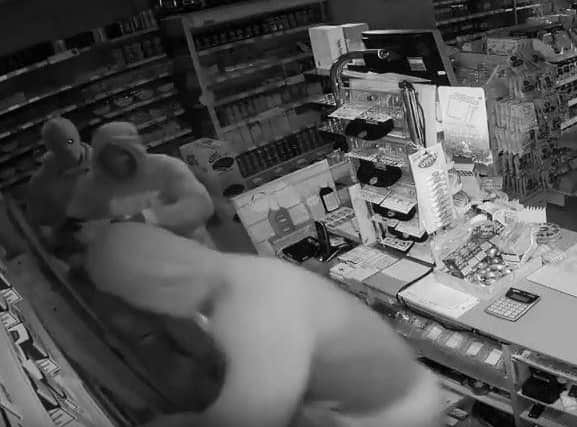 CCTV footage has been released showing three robbers in action in Rotherham
