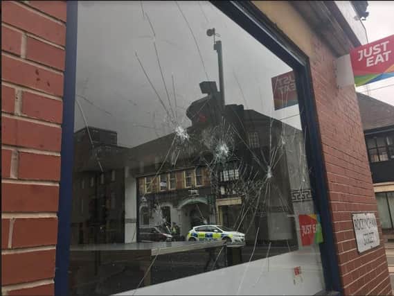 Police officers at Adnan's on the corner of West Street and Rockingham Street in Sheffield city centre, yesterday.