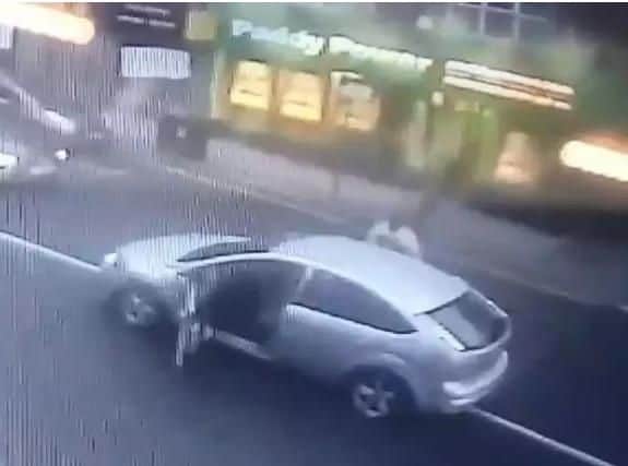A CCTV camera captured men jumping out of a car outside Paddy Power in London Road before another man was attacked