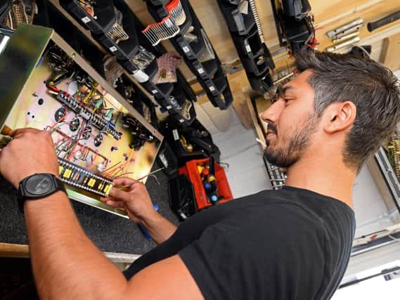 Arv Teeroovengadum, pictured inserting a pre-amp board for a custom 504. Picture: Marie Caley NDFP HIWATT MC 3