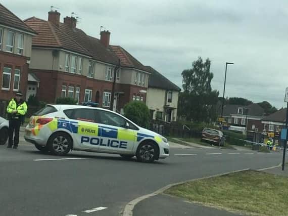 Police officers remain in Woodthorpe this morning after a shooting (Pic: Lauren Hague)