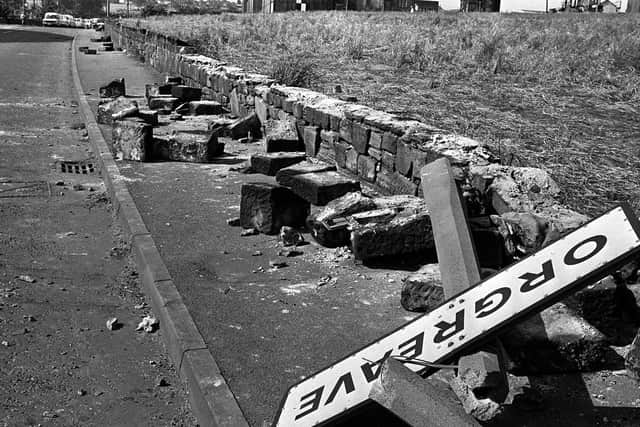 18/6/1984 of a twisted sign, felled concrete posts and a broken wall tell the story of violence outside a coking plant in Orgreave, South Yorkshire.
Photo: PA Wire