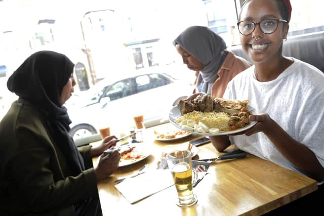 Pictured is Asma Kabadeh,co-owner of the Cafe 280 on Abbeydale Road celebrates the start of Eid festival by giving away free meals to her customers