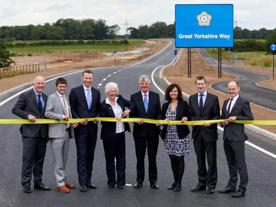 Great Yorkshire Way is officailly opened by, left to right, Lee Tinkler, Operations Director North, Tarmac; Dan Fell, Chief Executive Officer, Doncaster Chamber; Rob Coldrake, Northern Region Finance Director, TUI UK & Ireland; Ros Jones, Mayor of Doncaster; Robert Hough, Chairman, Peel Airports Group; Caroline Flint MP for Don Valley; Dan Jarvis, Mayor of the Sheffield City Region and Nigel Morley, of Mott MacDonald