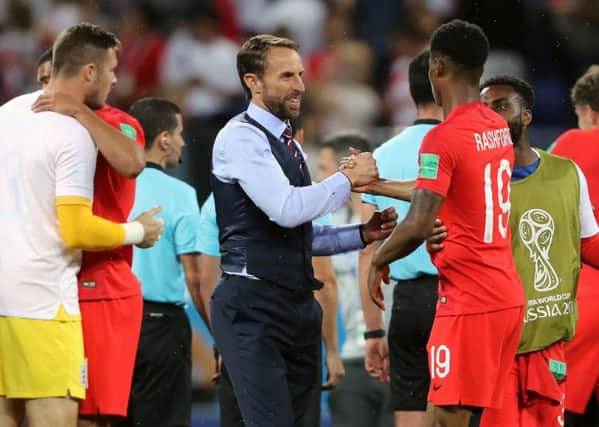 Gareth Southgate embraces substitute Marcus Rashford after England's victory over Tunisia