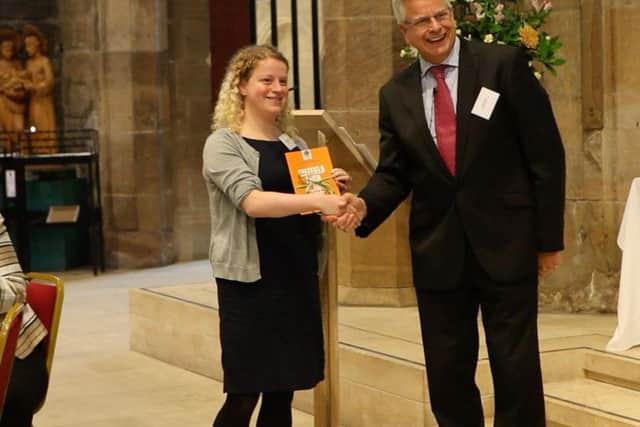 Jon Watts, of The Rock Christian Centre, Burngreave, presents a report to Olivia Blake, deputy leader of Sheffield Council. Picture: Anna Hodges