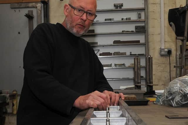 Mark Jackson, of Squarepegs, which makes coat hooks for schools at Portland Works. Picture: Andrew Roe