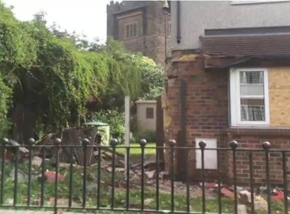 A house in Doncaster was damaged when a skip lorry crashed into it