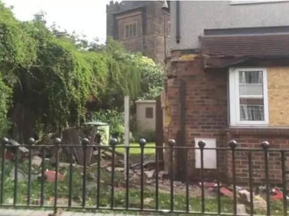 A house in Doncaster was damaged when a skip lorry crashed into it