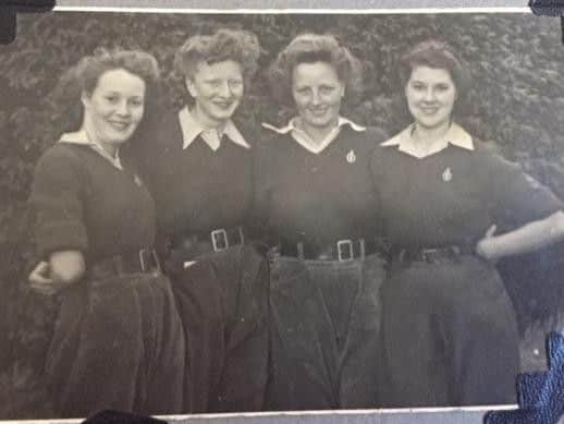 Betty, pictured far right, with the Land Army girls in the 1940s