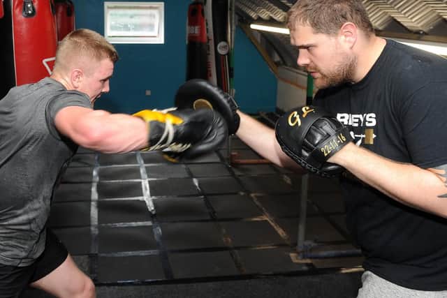James Rayworth on the pads with Gary Longmore at Riley's Gym.