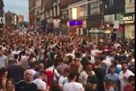 Fans celebrate an England win in Silver Street, Doncaster