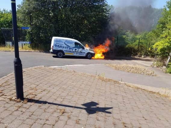 A van burst into flames after a pigeon flew into its engine. Picture: Justin Lee.