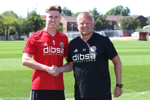 Dean Henderson is welcomed by manager Chris Wilder: Simon Bellis/Sportimage