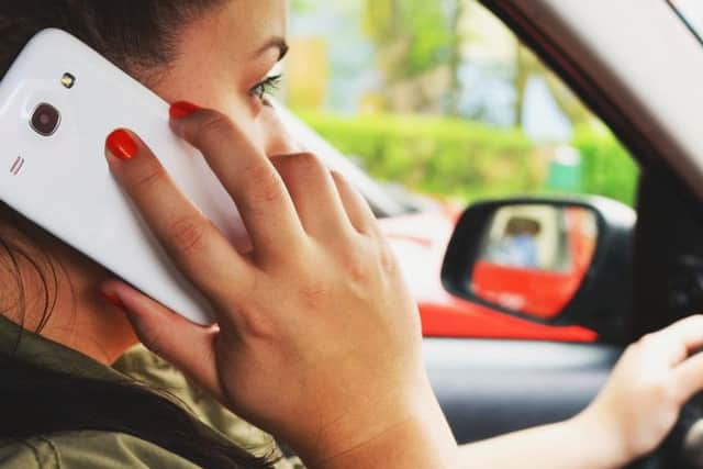 Using a hand-held mobile phone while driving has been illegal in the United Kingdom since 2003