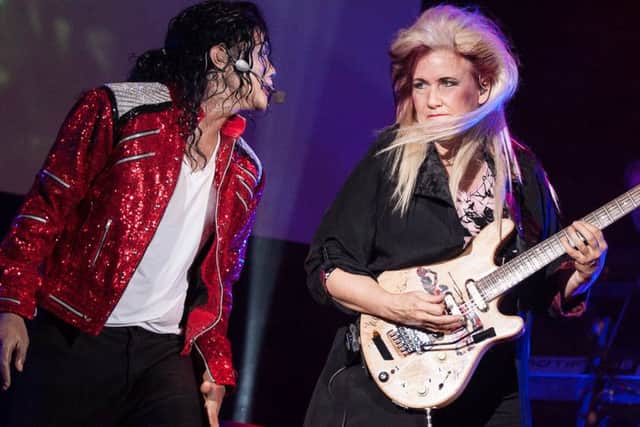 Navi And Jennifer Batten during aMichael Jackson King Of Pop concert.