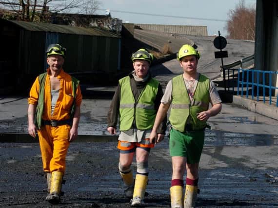 Miners walk to their last production shift at Rossington colliery. L-R John Dowling, Bob Stanard and Andy Harrison. (D0291CB)