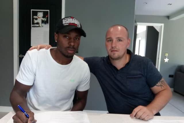 Shakiel Thompson signs with Adam Etches