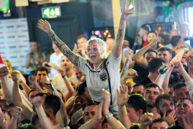 England fans in the Walkabout bar celebrating Saturday's win over Sweden. Picture: Steve Ellis