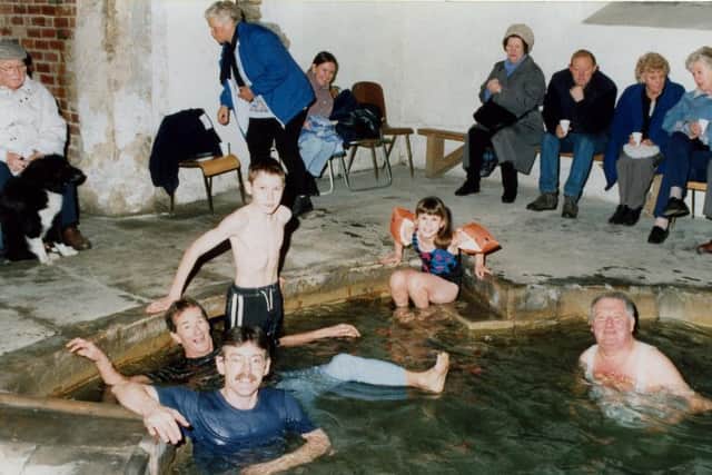 People taking a dip in Birley Spa Bath House at a New Year's Day party in 2000. Credit: Peter Wolstenholme