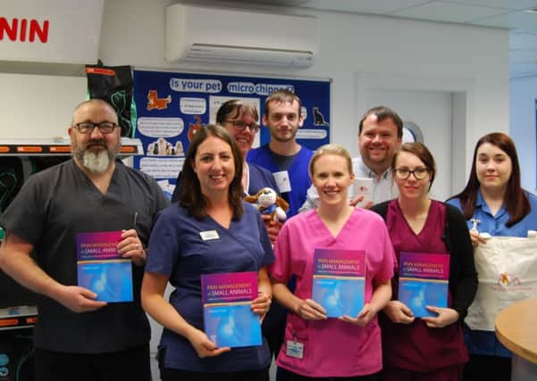 Staff at Springfield Veterinary Practice in Rotherham, Support Dogs vets, are pictured with copies of Debbie Gittleson's book,