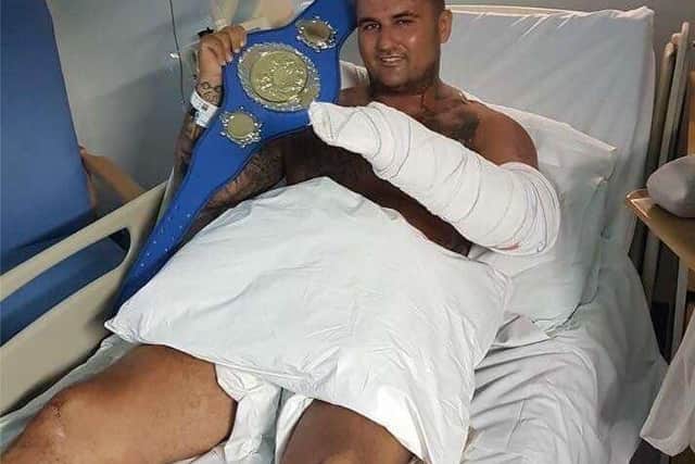 Brett May in his hospital bed