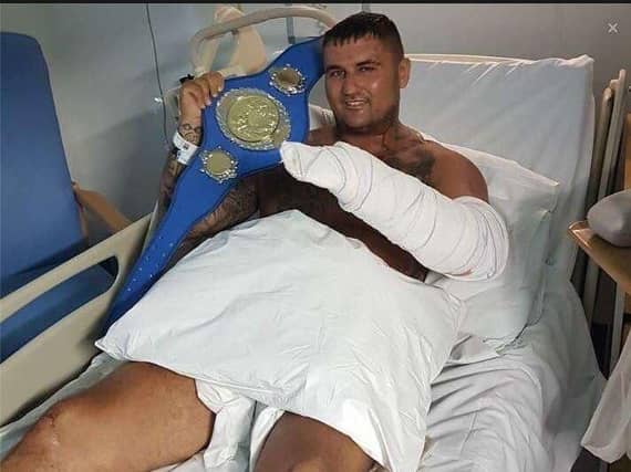 Brett May in his hospital bed