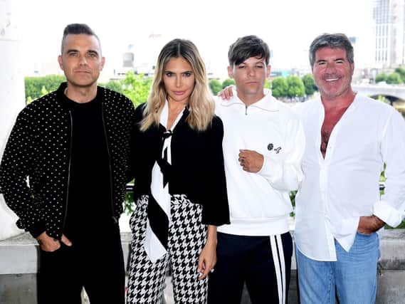 Doncaster's Louis Tomlinson has joined The X-Factor judging panel with Robbie Williams, Ayda Field and Simon Cowell. (Photo: PA).