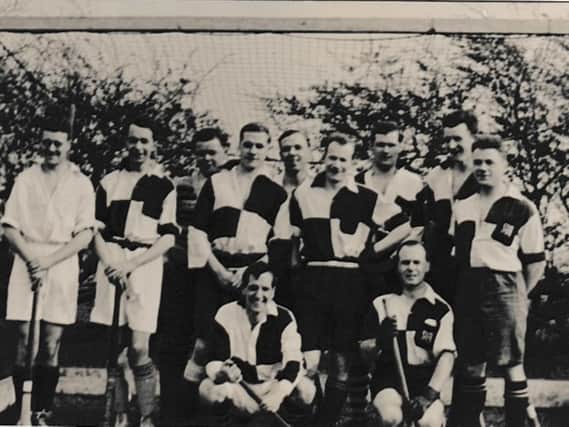 Hockey team including Bernard and Norman Moore, fourth and fifth, middle row, and Clyde Hague fifth from left, back row